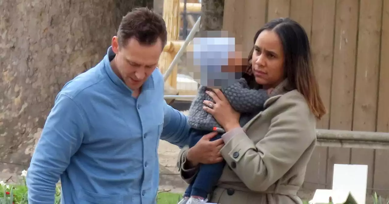 Tom Hiddleston and fiancée Zawe Ashton dote over their baby during Paris stroll