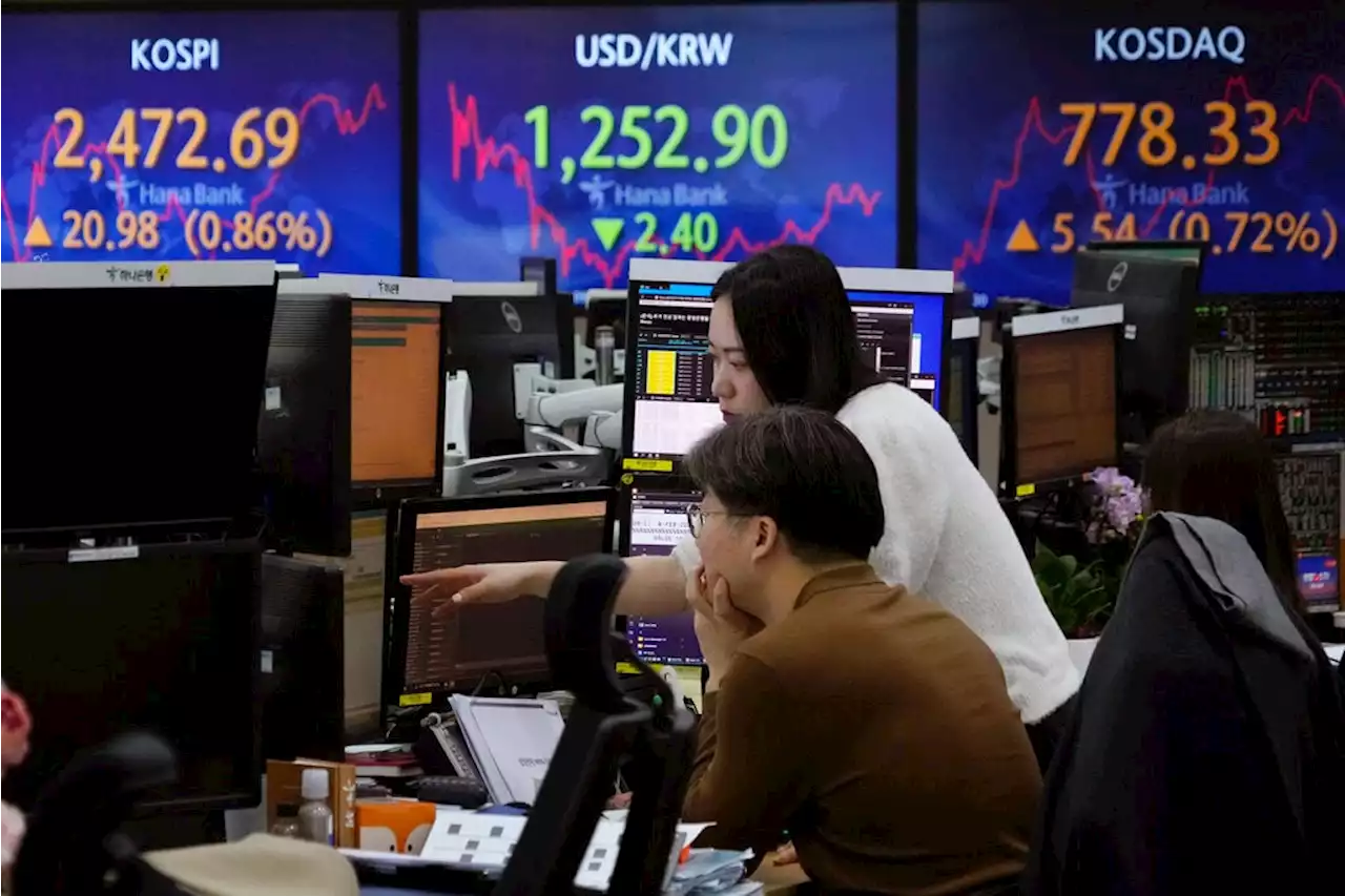 Asian shares subdued after Fed hints at rate pause