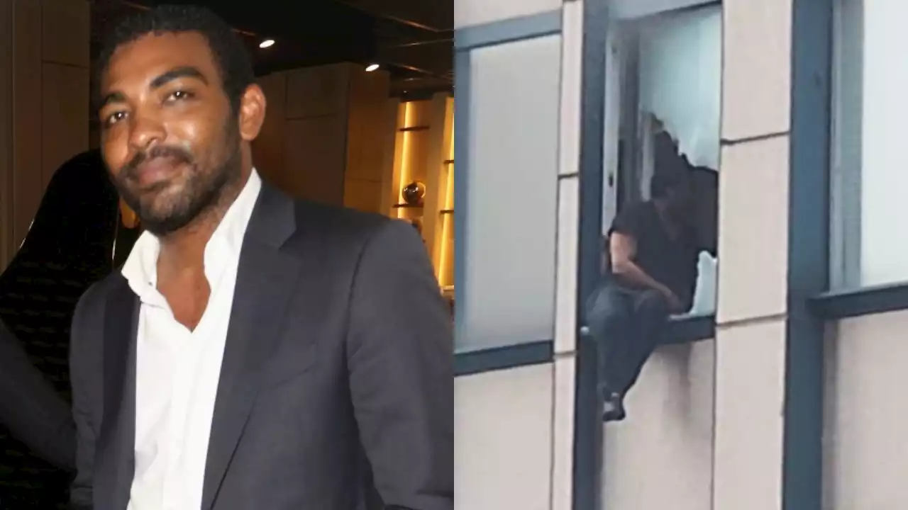 NYC conman perches on broken window of skyscraper as FBI raids apartment