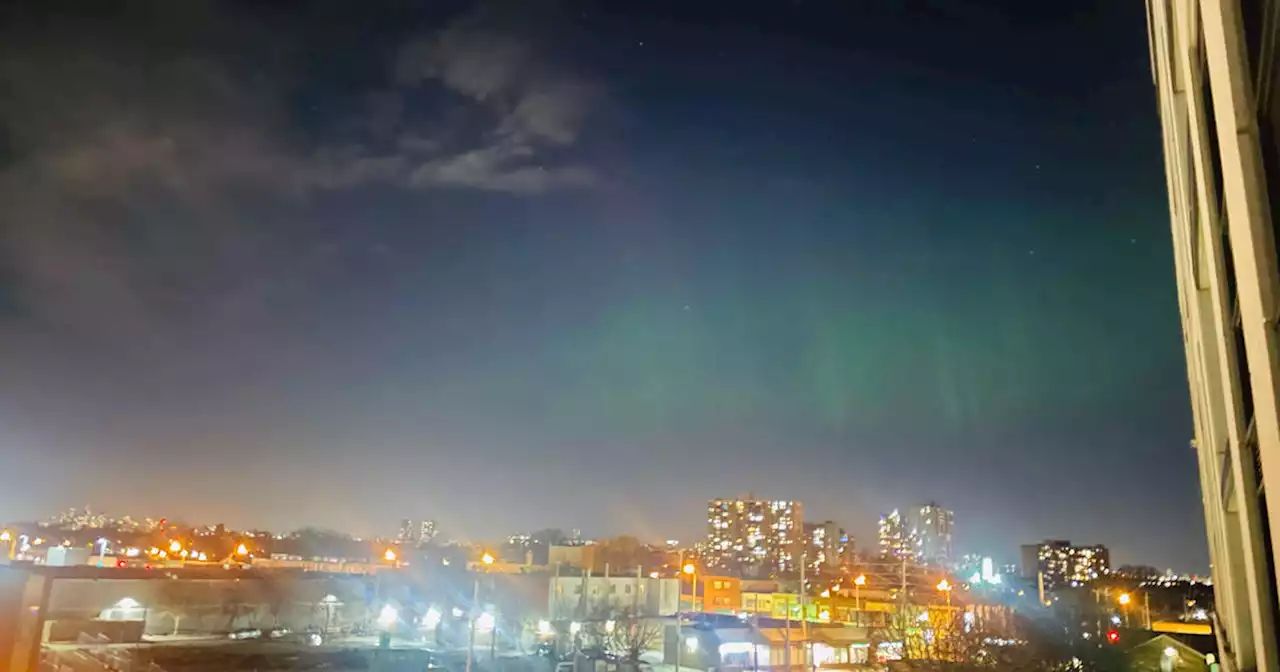 Dazzling photos show Northern Lights appear over downtown Toronto in rare display