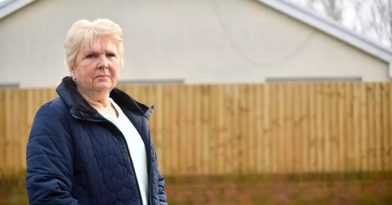 Neighbours face legal action after council order to lower height of their fences