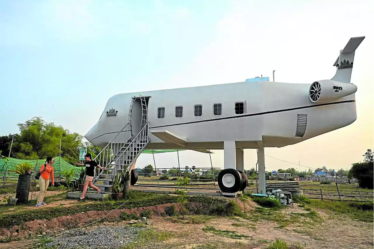 Cambodian man lands ‘airplane’ home in ricefield