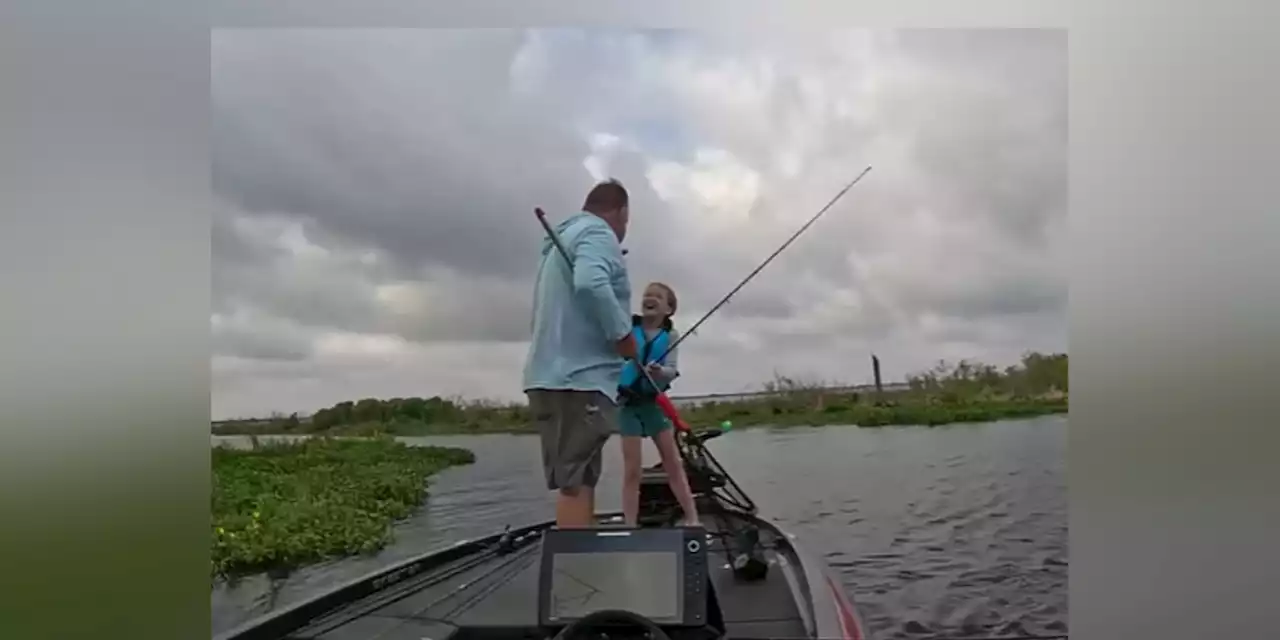 Priceless: Young girl reacts to catching her first big fish during father-daughter fishing trip