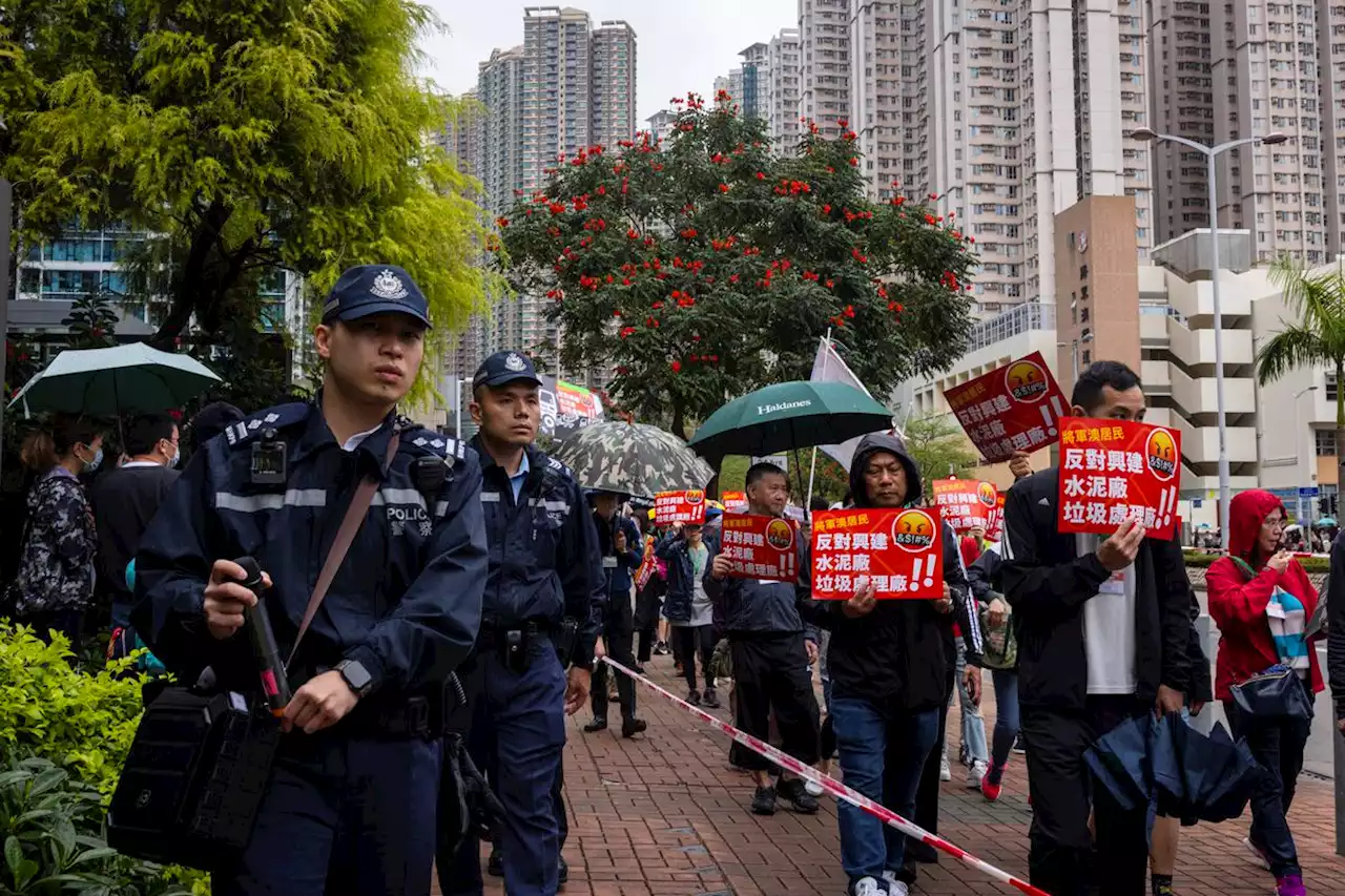 Hong Kong police keep tight tabs on first authorized protest since 2020