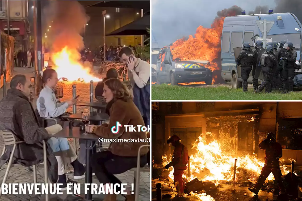 French diners sip wine as fires break out in protest against Macron