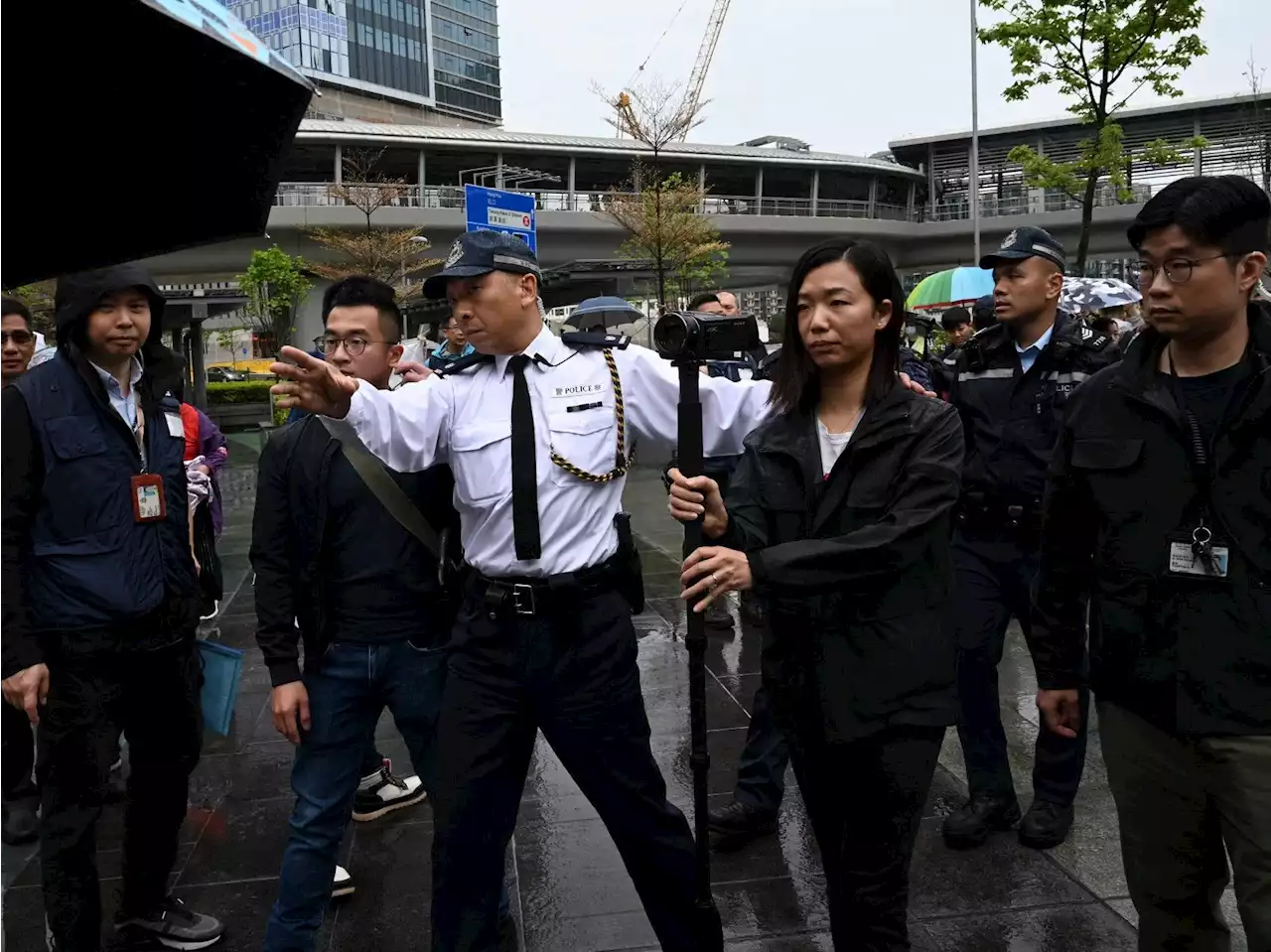 Badges, masks and police: What protests look like now in 'new' Hong Kong