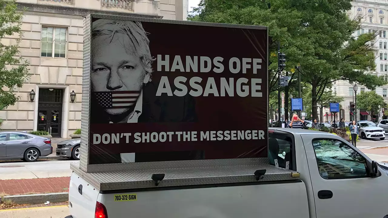 Julian Assange supporters gather in London for exhibition of largest physical showing of classified docs