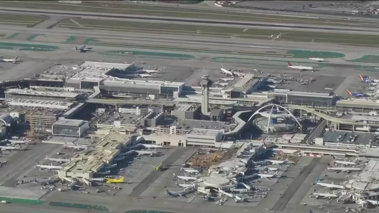 Police: passenger pulled jet’s emergency slide at LA airport