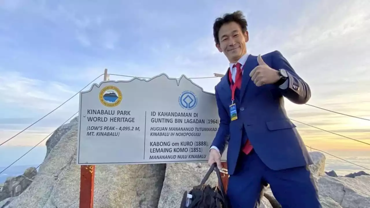 #trending: Japanese tailor climbs Mount Kinabalu in full suit and tie to promote clothing brand