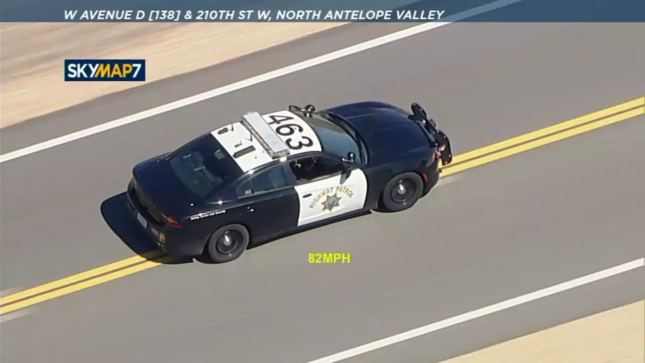 Caught on camera: Suspect jumps onto highway from speeding stolen police vehicle during pursuit