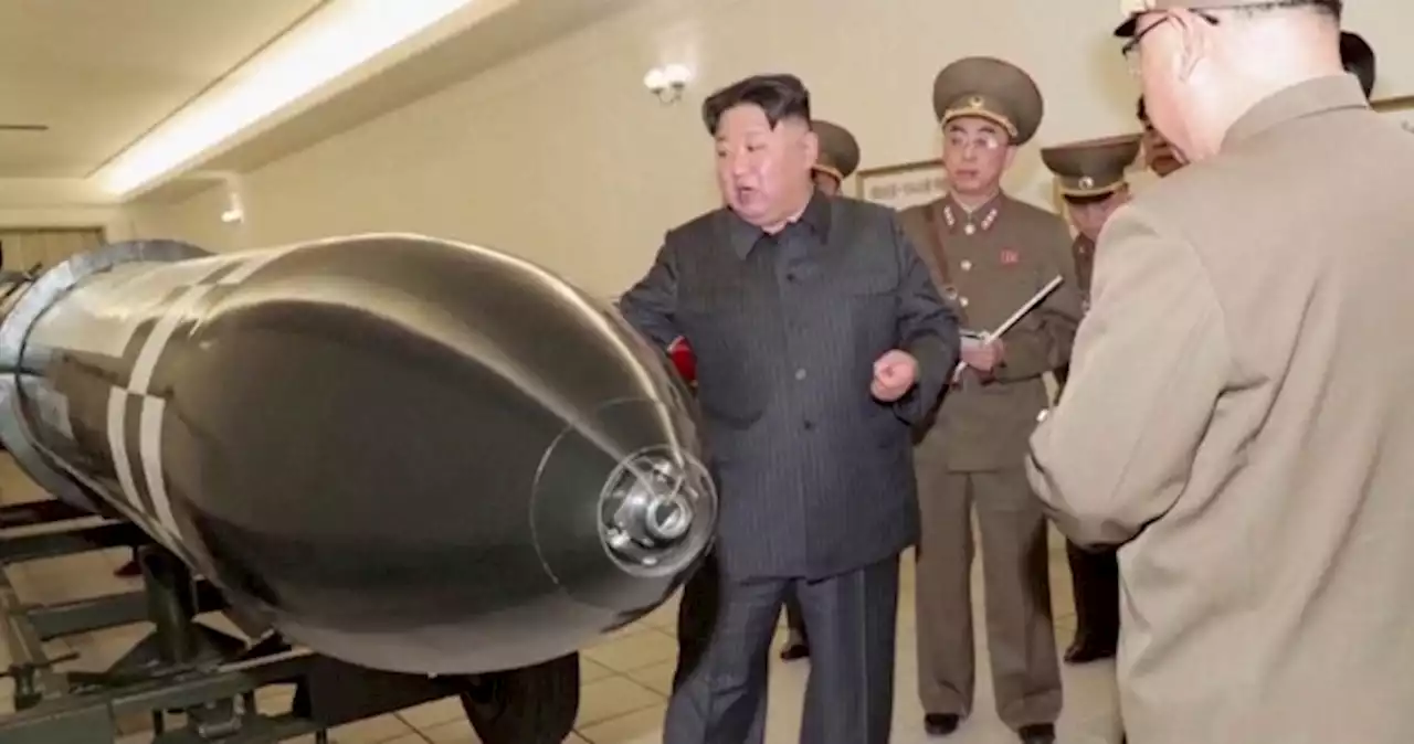 North Korea unveils new nuclear warheads as US air carrier arrives in South