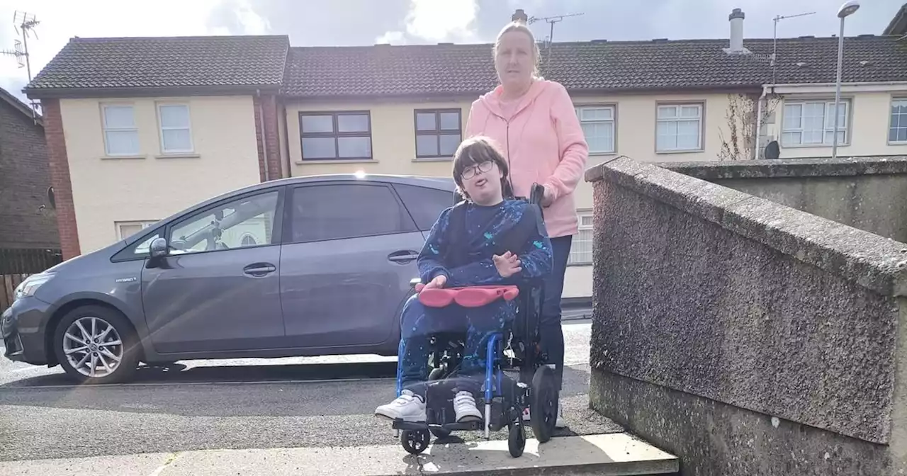 Mum 's plea as disabled son climbs steps on hands and knees to get to school bus