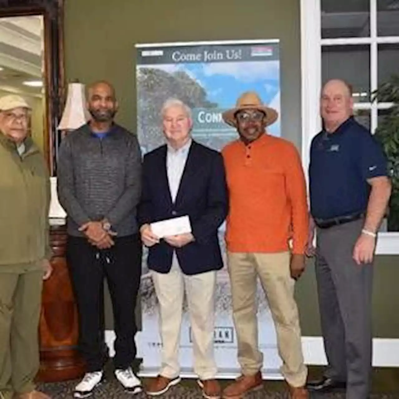 Dothan Area Chamber presents check to help build NFL turf field