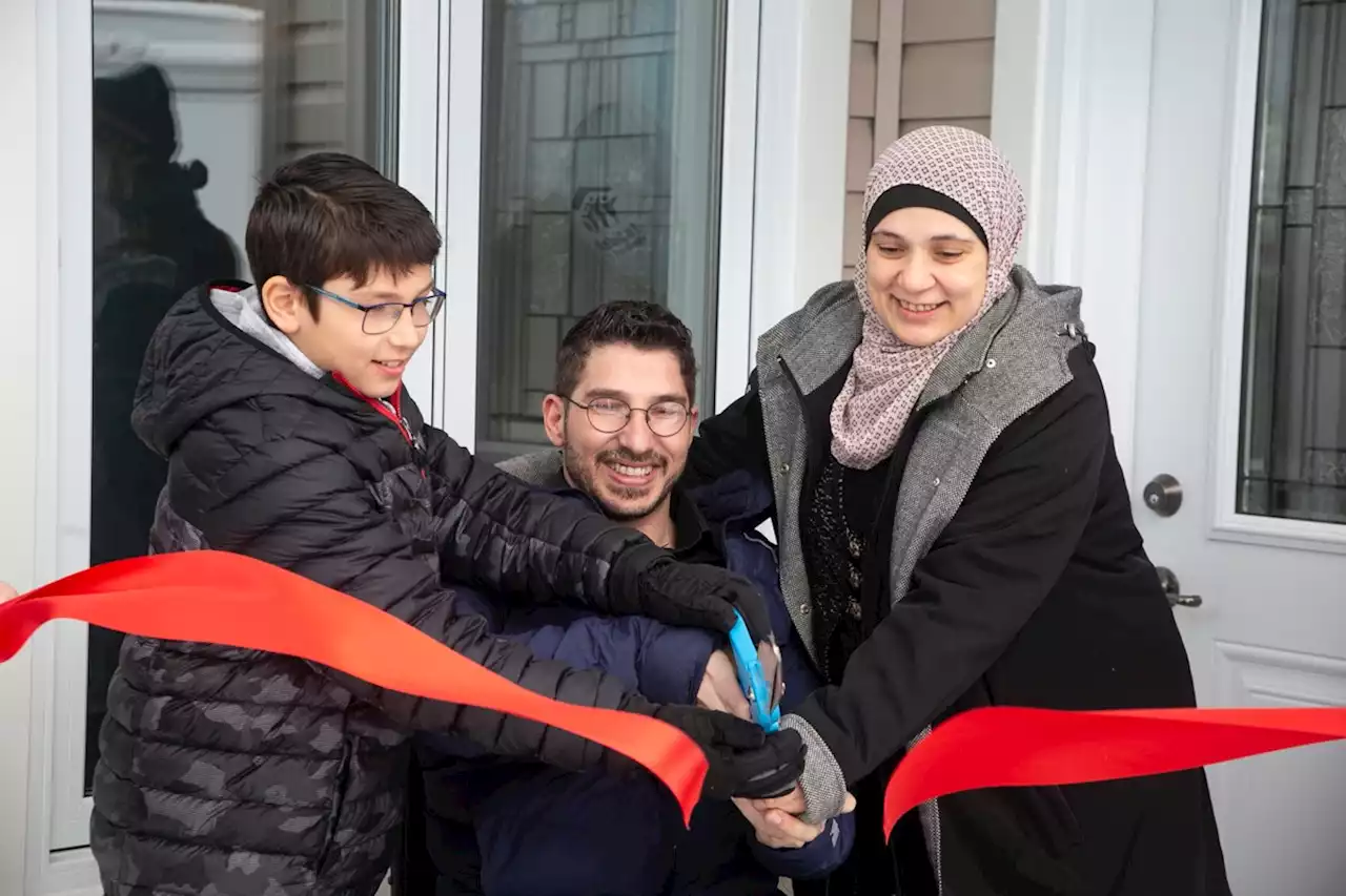 Habitat for Humanity hands new house keys to grateful local family