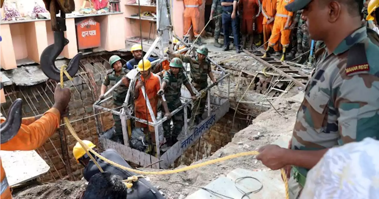 Indian officials discover 36 bodies inside well after temple collapse - National | Globalnews.ca