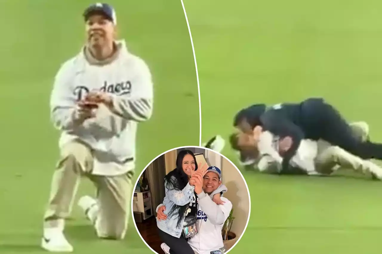 Dodgers fan gets tackled by security in disastrous on-field proposal