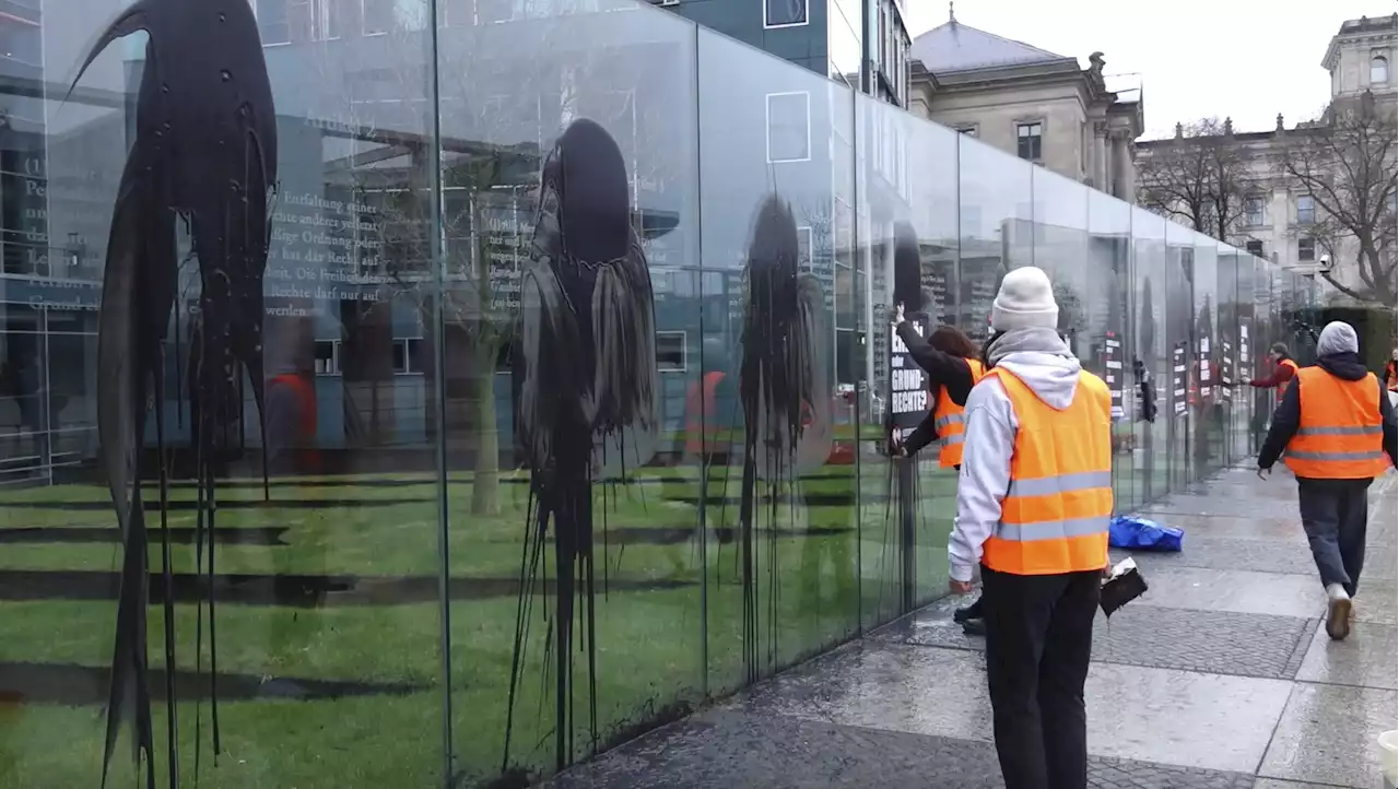 Climate activists target art work near German parliament