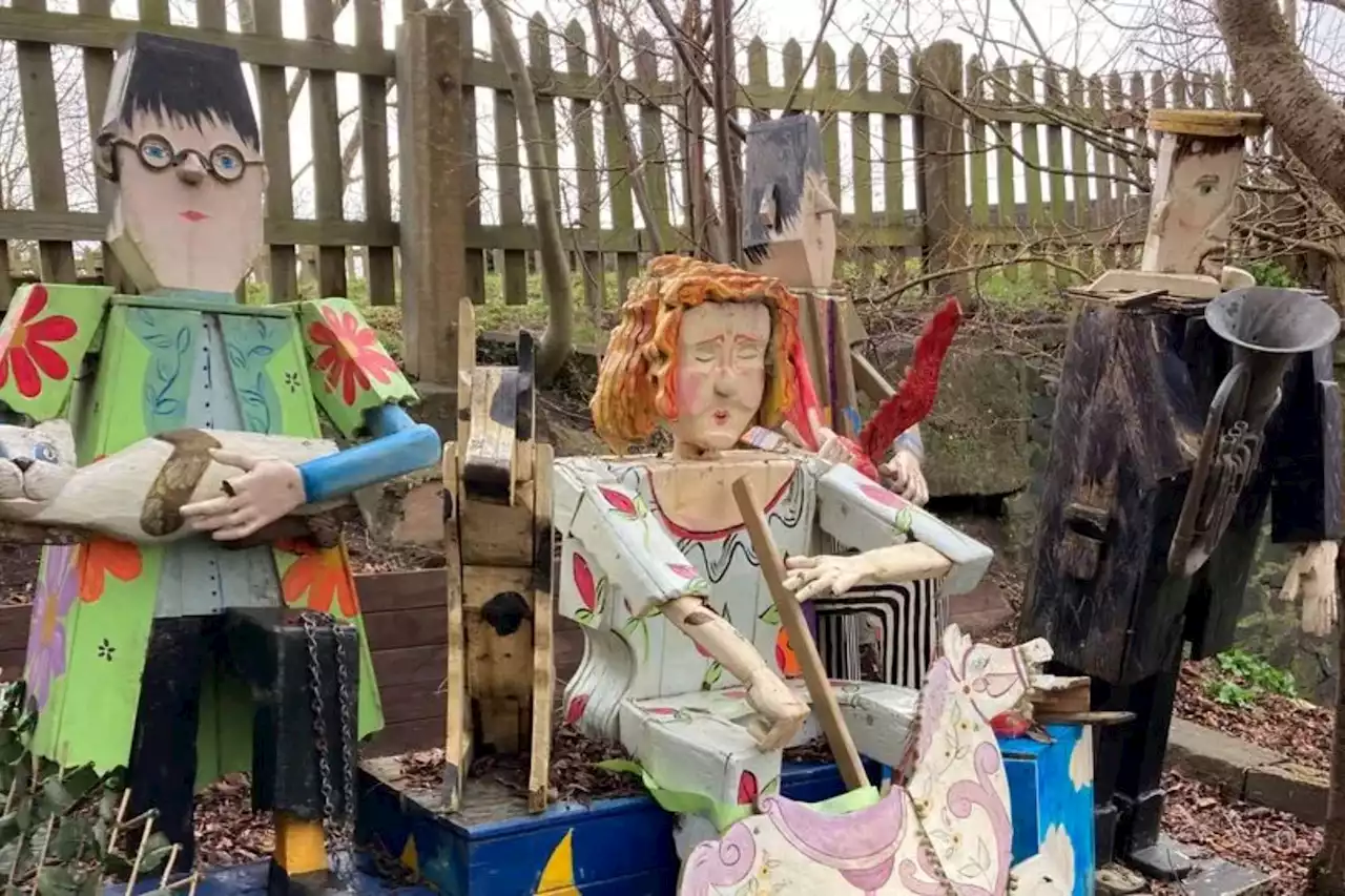 Inside 'UK's weirdest village' with huge SHARK & bizarre wooden statues