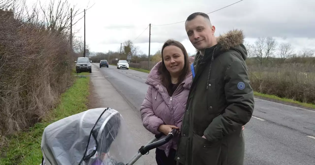 Signs go up amid anger at parking on road where cars fly by