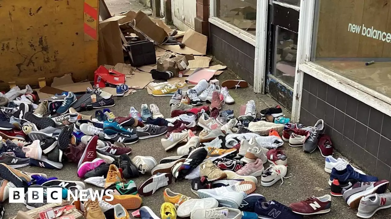 Outrage as hundreds of New Balance trainers found in skip