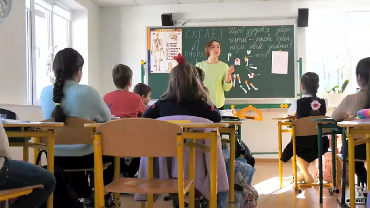 At this Ukrainian school, students not only bring their books. They also carry emergency bags