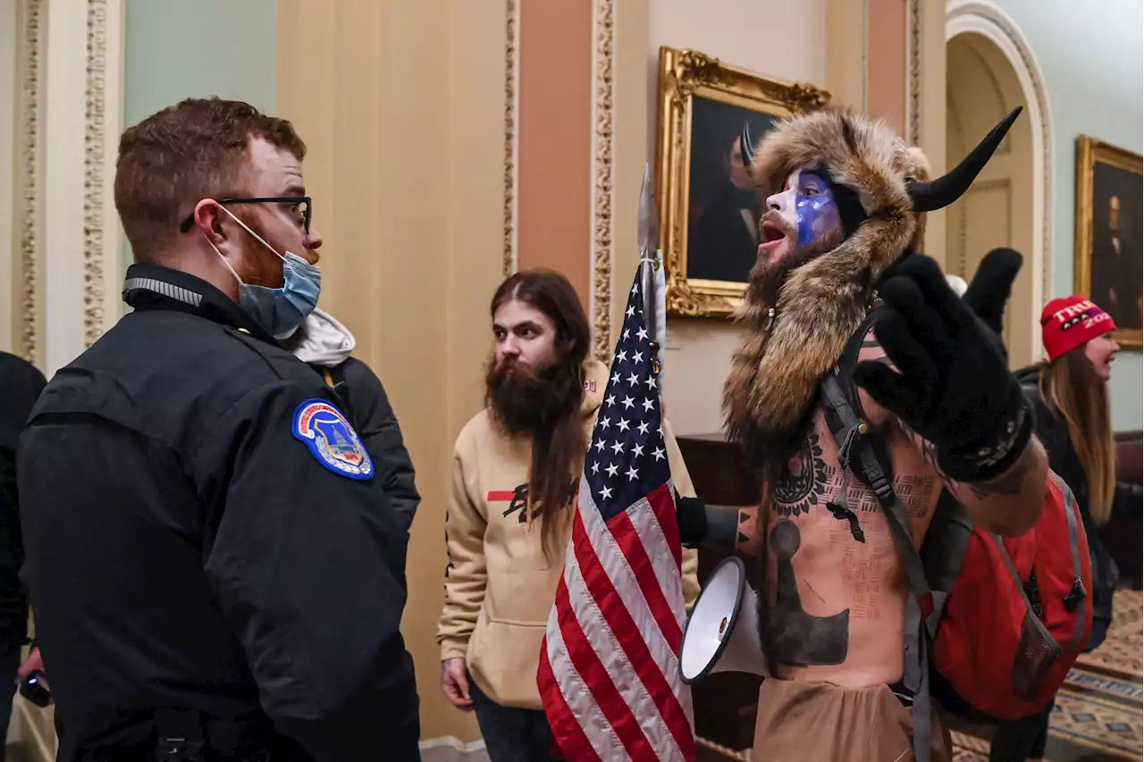 QAnon Shaman video raises questions about Capitol Police officers