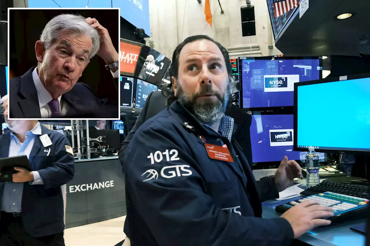 Dow plunges over 300 points after Powell stokes fears of big rate hike