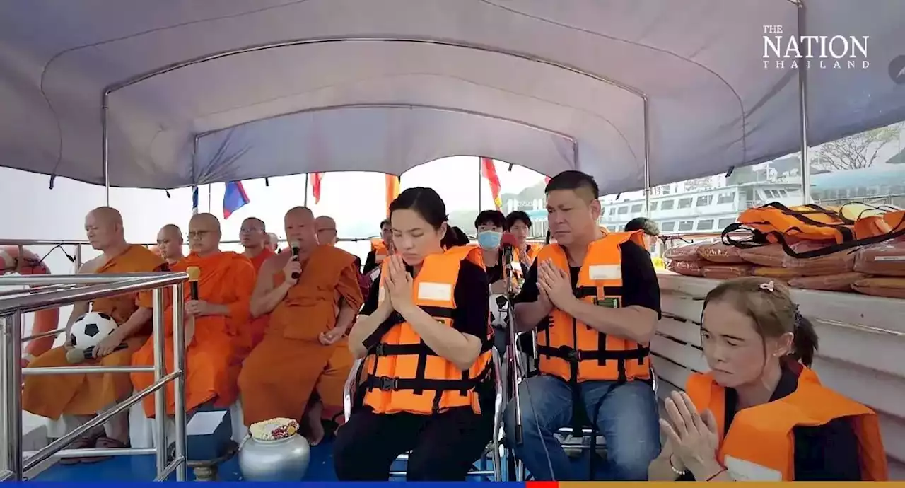 Ashes of Thailand 'cave boy' released on Mekong River as family and friends say final farewell