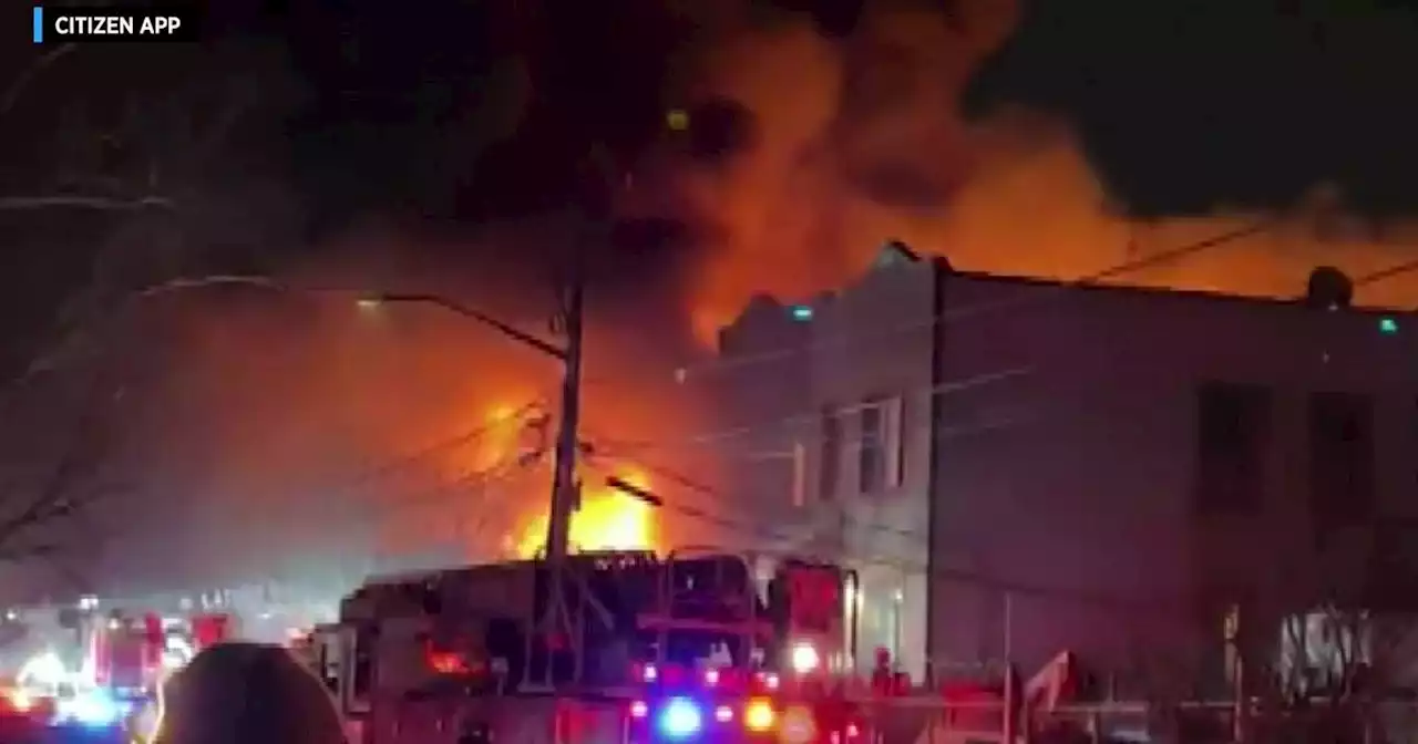 9 firefighters injured in wind-driven fire across several buildings in Queens