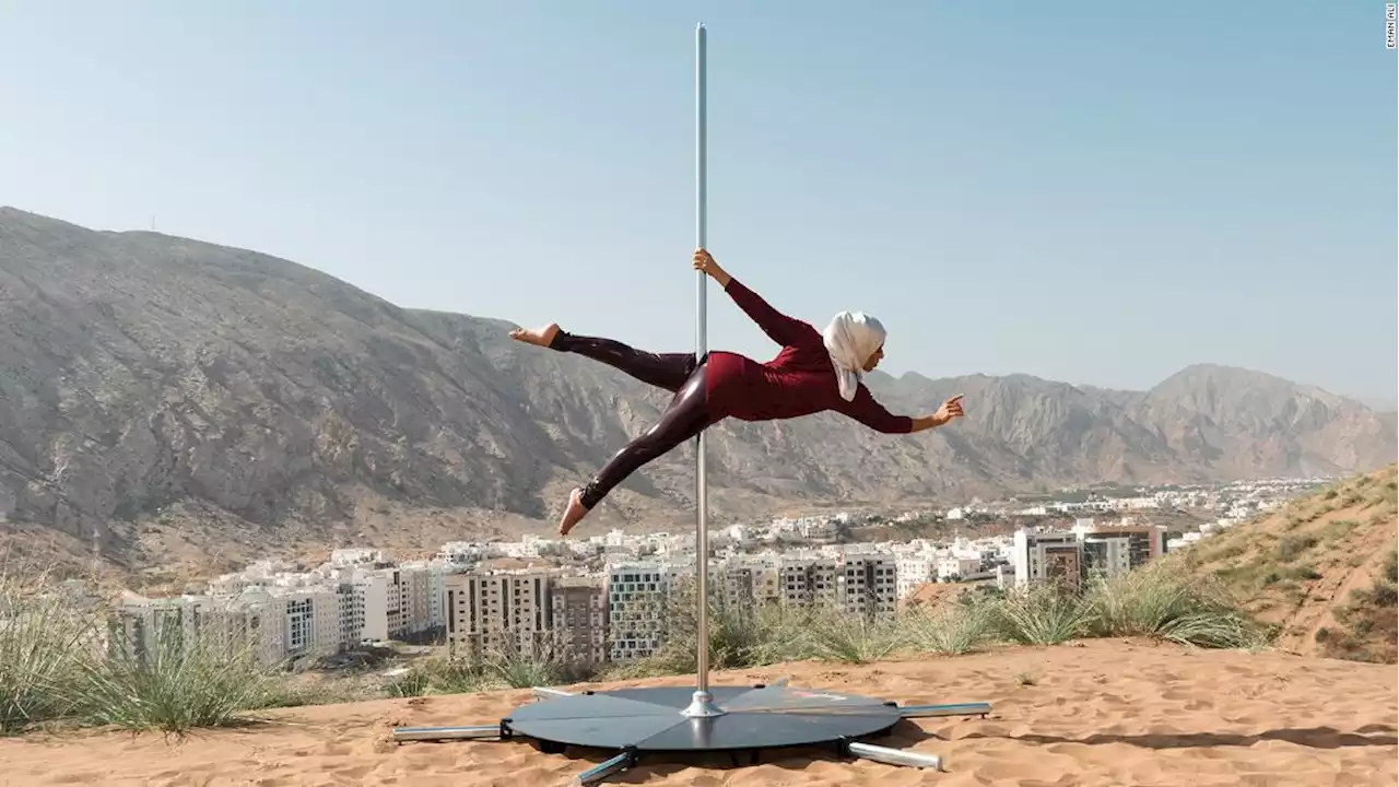 An elegant portrait of a pole dancer in Oman celebrates a woman's strength in nature