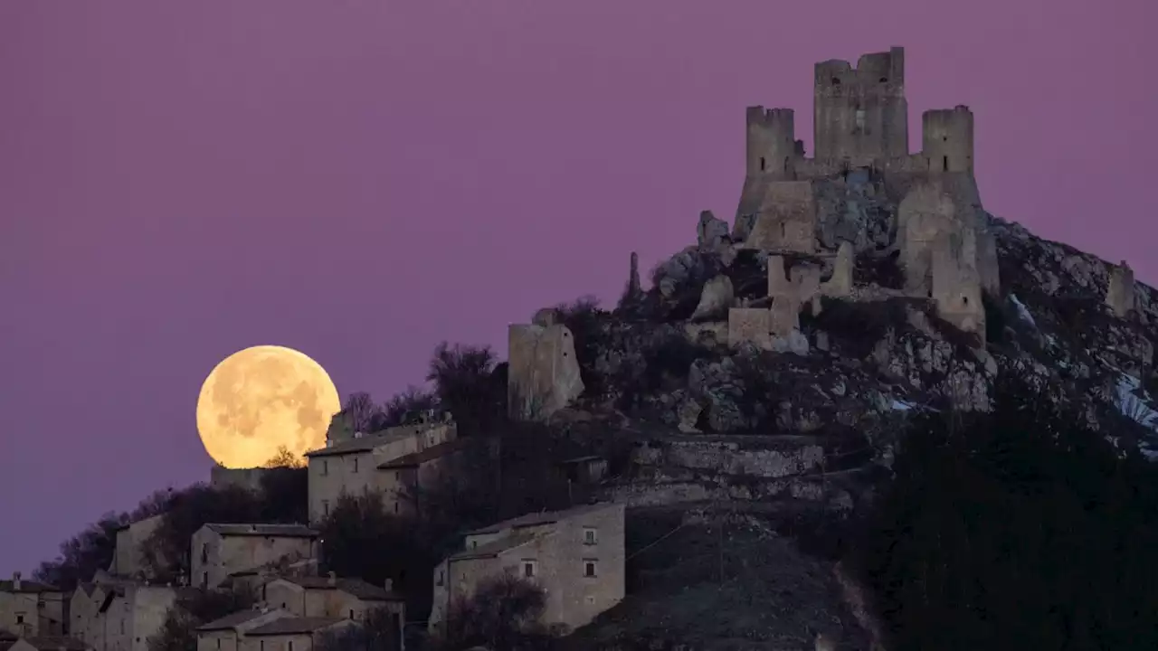 Full moon worms its way into stunning photos from around the world