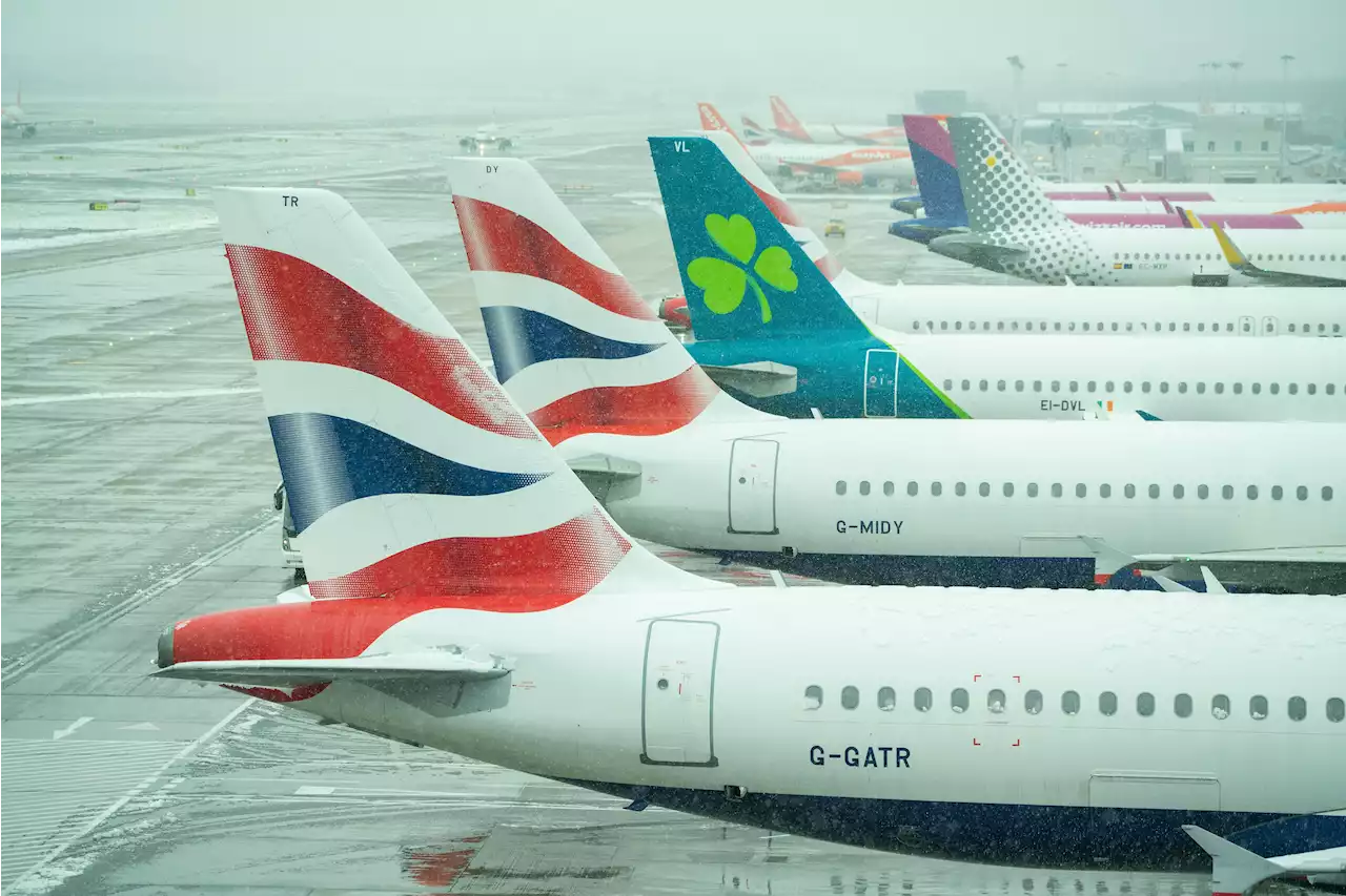 UK airport closes and airlines cancel flights as snow causes travel chaos