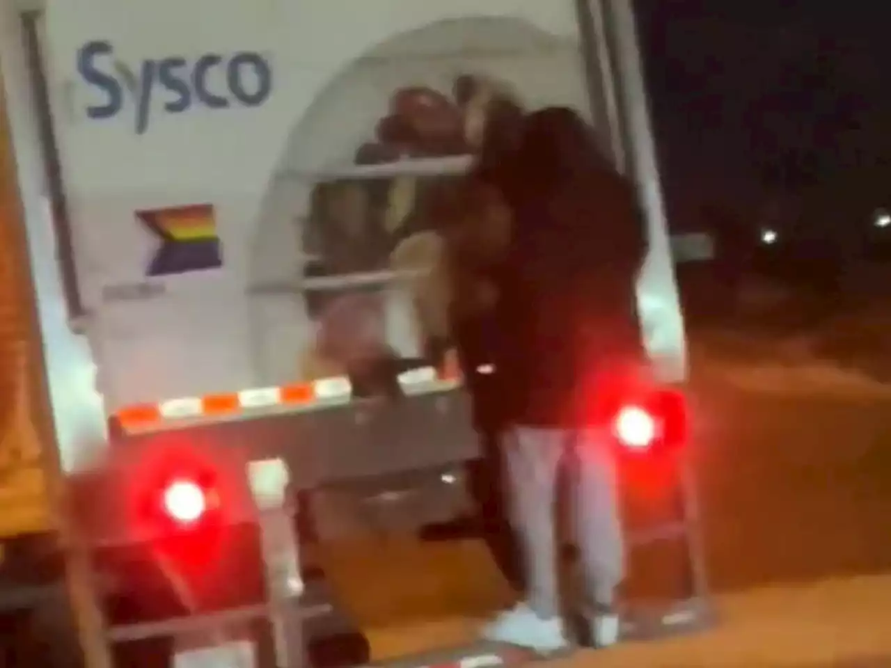 Video shows man hanging on back to transport truck on QEW: OPP