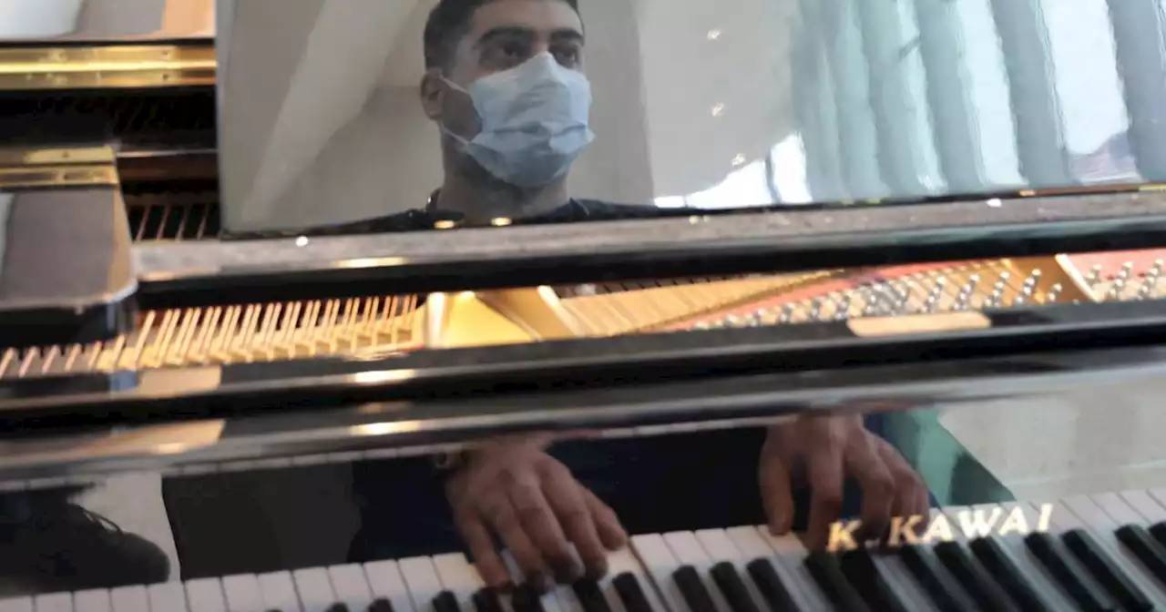 Healing starts in the lobby at a Barrington hospital, where volunteer musicians play their passion