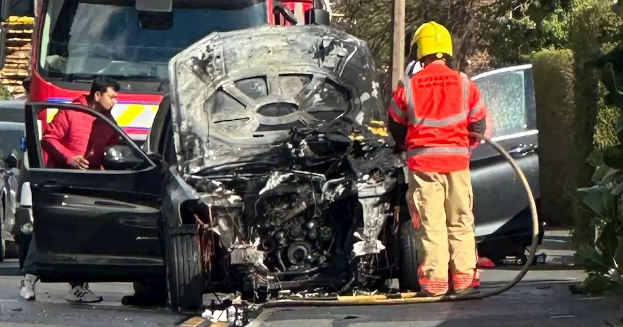 Occupants escape unharmed moments before car bursts into flames