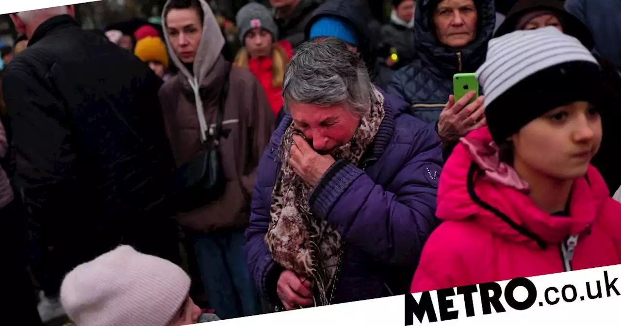 Bucha falls silent to mark a year since the city was liberated from Russia