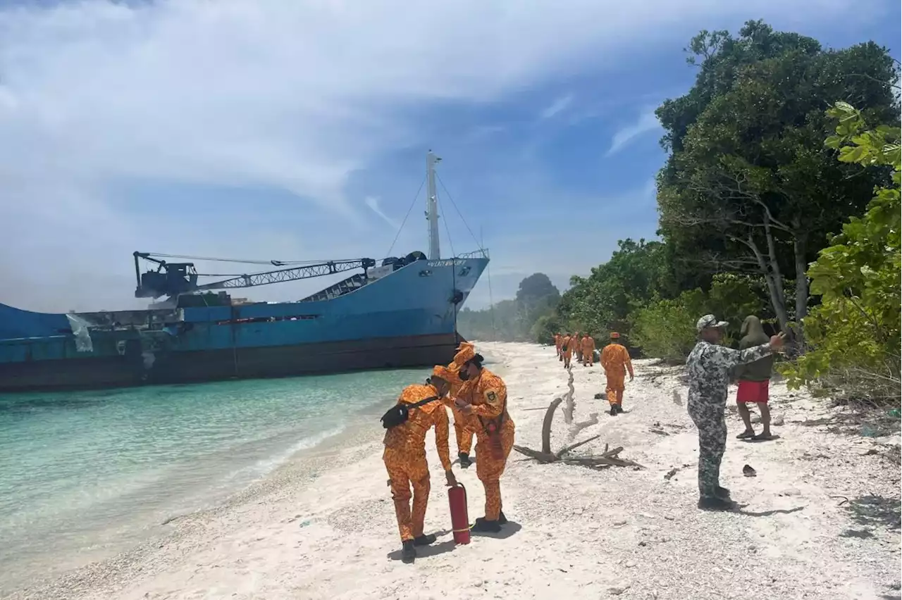 Death scene in burned Filipino ferry moves rescuers to tears