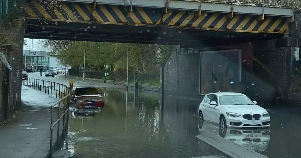 Cars left submerged as rain causes road in Levenshulme to flood AGAIN