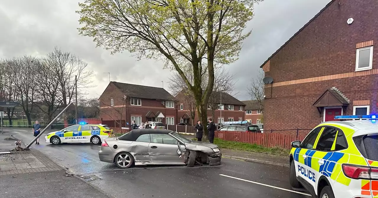 Road closed after 'car smashes into bus stop'