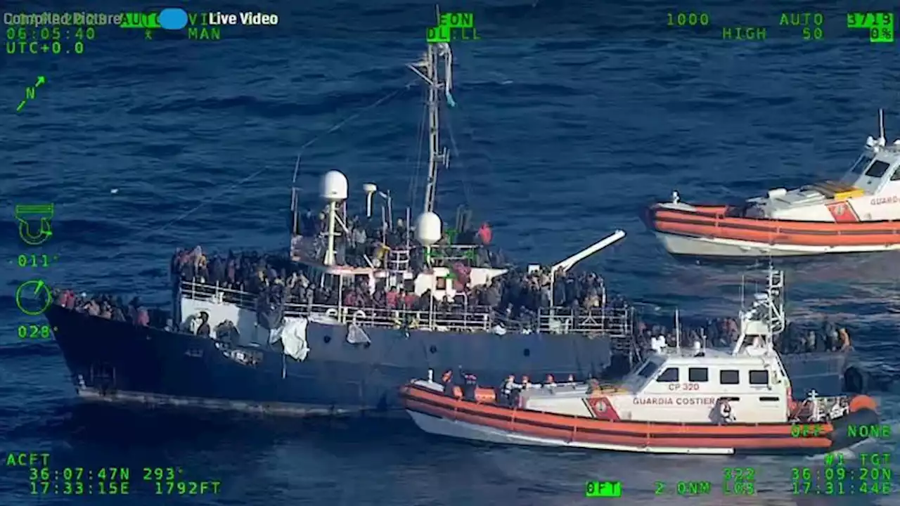 Italian Coast Guard escorting boat carrying 400 migrants in Mediterranean Sea | CNN