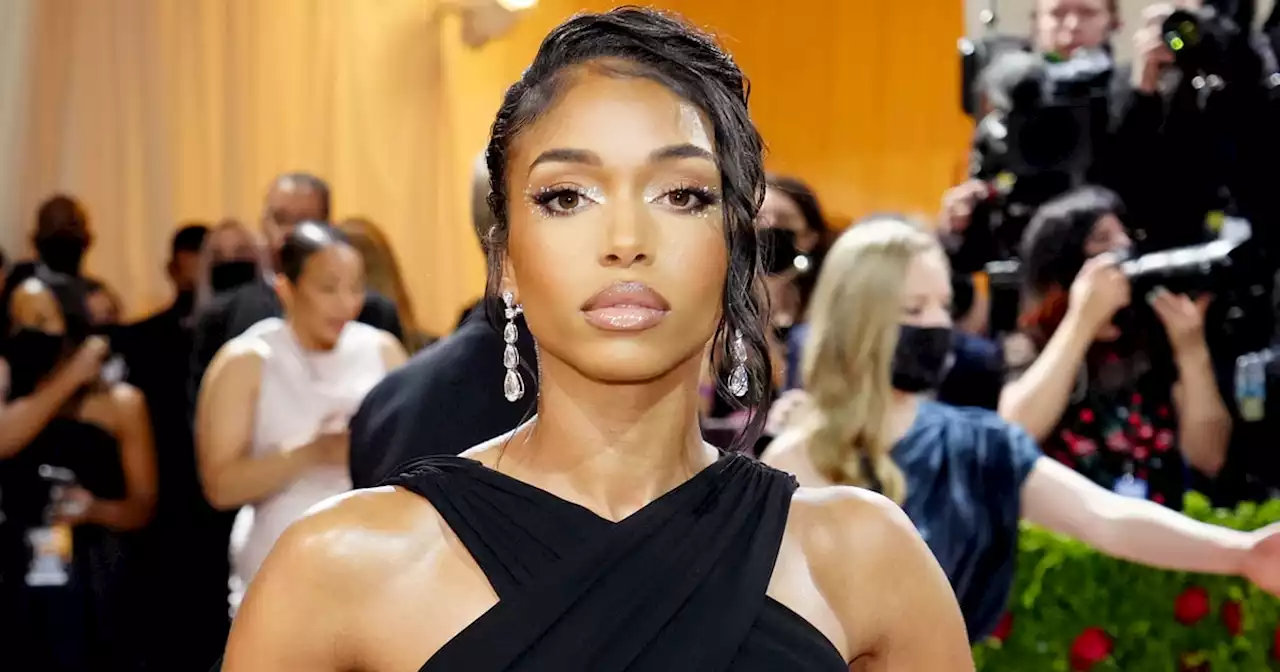 Lori Harvey Brings the Heat on Vacation in an Extremely Low-Cut Swimsuit