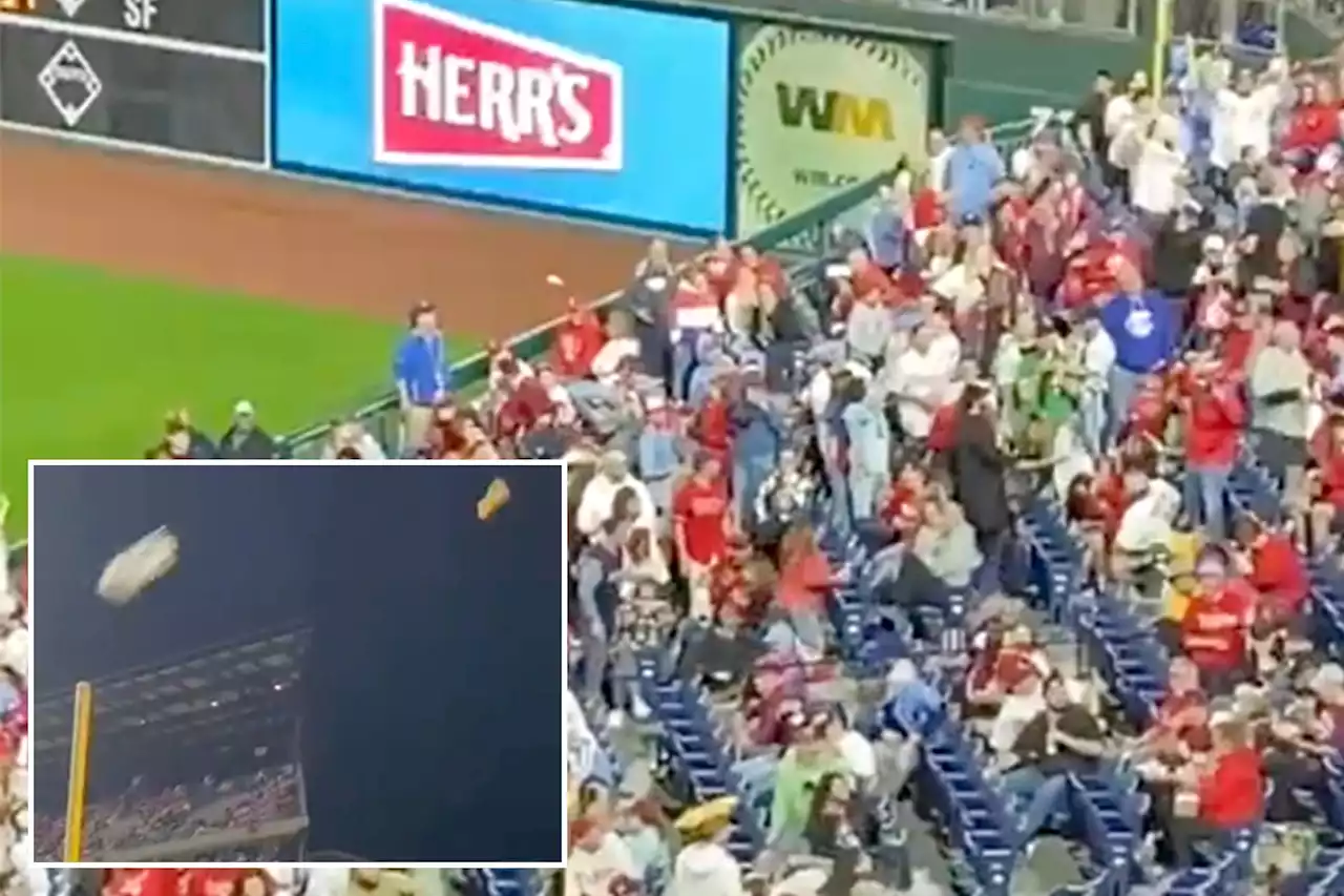 Phillies fans toss garbage at each other in wild scene on $1 hot dog night