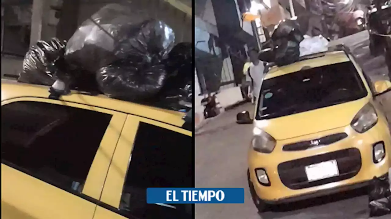 Medellín: taxi no dejó pasar el camión recolector y le pusieron la basura encima