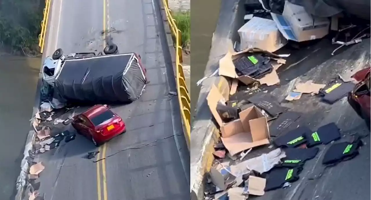 Camión de la Policía, afectado por caída de puente del río La Vieja; llevaba armamento - Pulzo