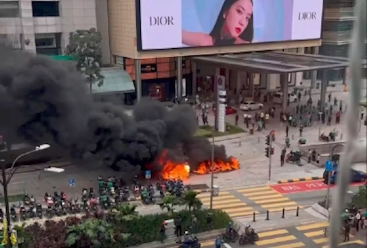 Cops arrest man a few hours after fire damages vehicles outside KLCC