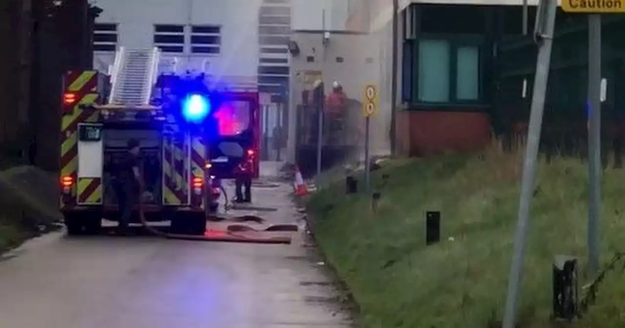 Firefighters race to burning building next to south Manchester school