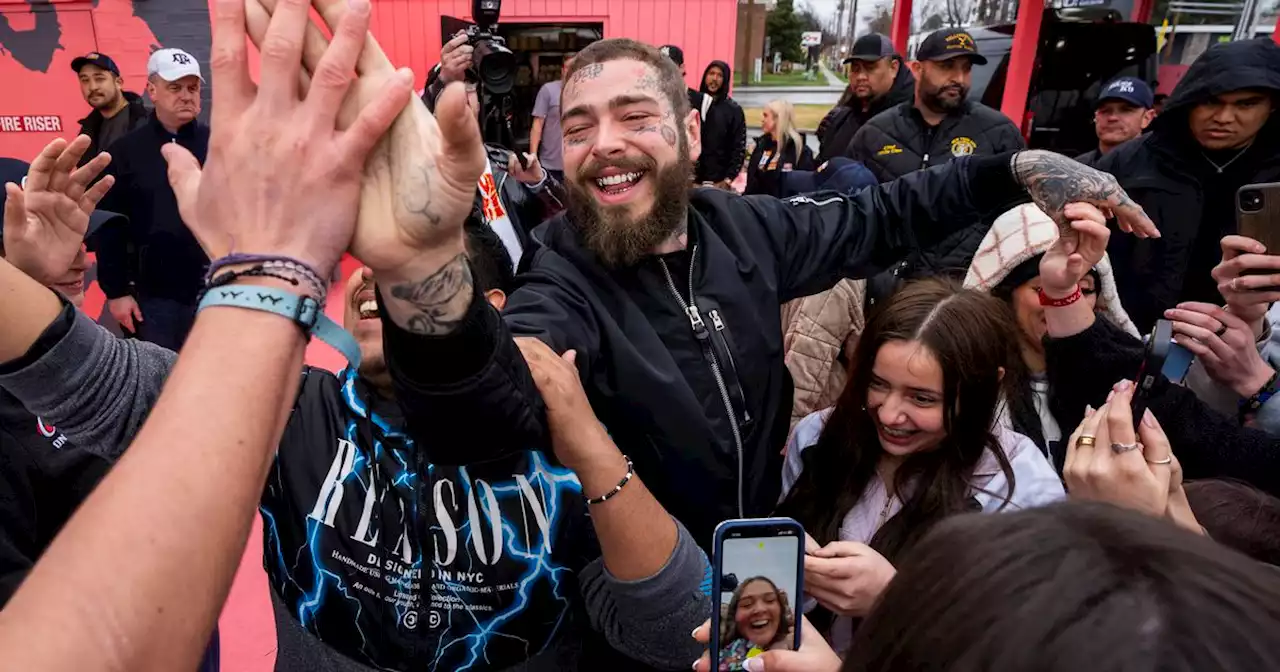 Fans throng rapper Post Malone at Utah fast-food location that he designed