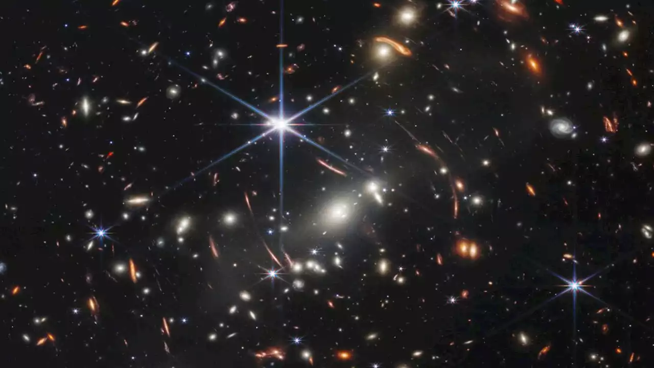 How do we know how far away and early in the universe galaxies are?