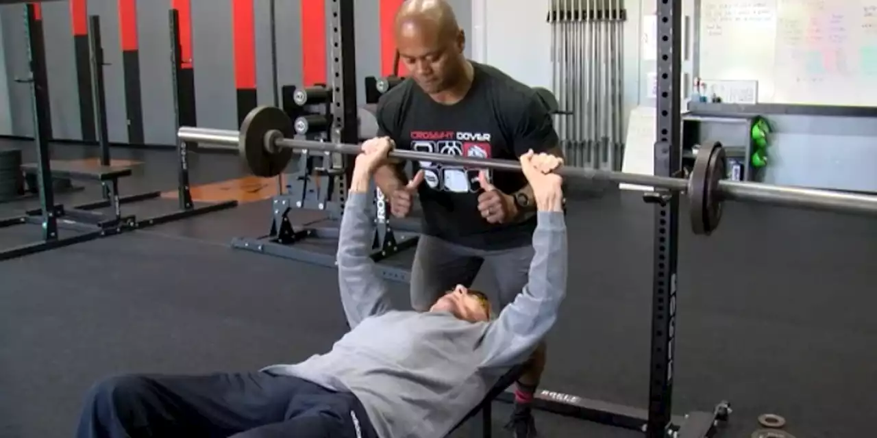 WWII veteran bench presses 100 lbs. to celebrate centennial birthday