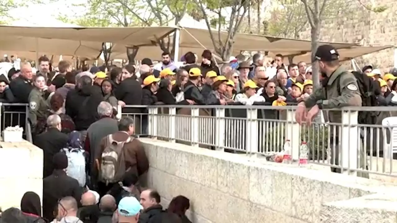 Orthodox Christians await Holy Light in Jerusalem under heavy police restrictions